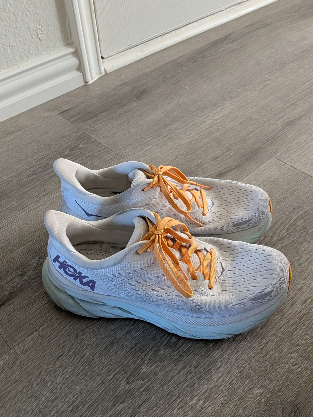 Hoka One White Sneakers with Orange Laces and Purple Logo